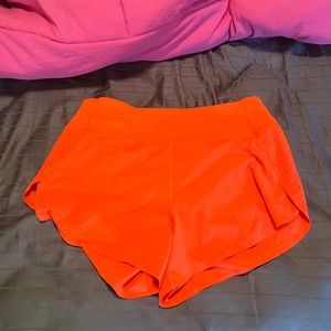 Bright orange Athleta shorts